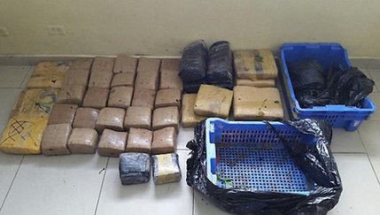 apresan coronel de la policia en transaccion de 41 pacas de marihuana